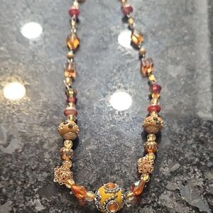 Elegant Beaded Necklace with Gold and Orange Accents